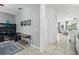 View down a hallway showcasing tile floors and access to other rooms at 5229 Oakbourne Ave, Davenport, FL 33837