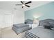 Guest bedroom with two twin beds and ceiling fan at 5229 Oakbourne Ave, Davenport, FL 33837
