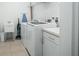 Clean laundry room with washer, dryer, and utility sink at 5229 Oakbourne Ave, Davenport, FL 33837