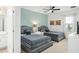 Guest bedroom with two twin beds and ceiling fan at 5229 Oakbourne Ave, Davenport, FL 33837