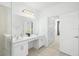Bright bathroom with double vanity and a large shower at 5229 Oakbourne Ave, Davenport, FL 33837