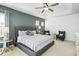 Spacious main bedroom with king bed and accent chairs at 5229 Oakbourne Ave, Davenport, FL 33837