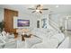 Open living room with comfortable seating and large TV at 5229 Oakbourne Ave, Davenport, FL 33837