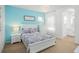 Charming bedroom with a queen bed and en-suite bathroom at 5229 Oakbourne Ave, Davenport, FL 33837