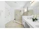 Bathroom boasts double vanity, large shower, and modern fixtures at 5229 Oakbourne Ave, Davenport, FL 33837