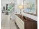 Bright entryway with stylish console table and view to living room at 5229 Oakbourne Ave, Davenport, FL 33837