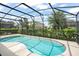 Inviting kidney-shaped pool with screened enclosure at 5229 Oakbourne Ave, Davenport, FL 33837