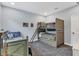 bedroom with twin-over-full bunk bed and built-in drawers at 10472 Petrillo Way, Winter Garden, FL 34787