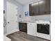 Laundry room with washer, dryer, and dark cabinets at 10472 Petrillo Way, Winter Garden, FL 34787