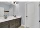 Bathroom with double vanity and modern dark brown cabinets at 10472 Petrillo Way, Winter Garden, FL 34787