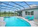 Inviting freeform pool with a spa and blue tile at 10472 Petrillo Way, Winter Garden, FL 34787