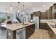 Large kitchen island with granite countertop, perfect for casual dining at 10472 Petrillo Way, Winter Garden, FL 34787