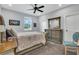 Bedroom with a queen-size bed, light wood furniture, and neutral decor at 10472 Petrillo Way, Winter Garden, FL 34787