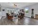 Relaxing living room with hardwood floors, comfortable seating, and large windows at 10472 Petrillo Way, Winter Garden, FL 34787