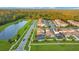 Community view showing homes, lake, and green spaces at 10472 Petrillo Way, Winter Garden, FL 34787