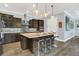 Modern kitchen with island and stainless steel appliances at 10472 Petrillo Way, Winter Garden, FL 34787