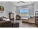 Cozy office space with a comfortable seating area and large window at 10472 Petrillo Way, Winter Garden, FL 34787