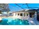 Inviting kidney-shaped pool with a screened enclosure at 7567 Brightwater Pl, Oviedo, FL 32765