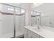 Clean bathroom with walk-in shower and white vanity at 2654 Rosemont Cir, Davenport, FL 33837