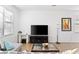 Living room with gray sectional sofa and large TV at 2654 Rosemont Cir, Davenport, FL 33837