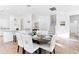 Open concept dining room with table and chairs, view of kitchen and staircase at 2654 Rosemont Cir, Davenport, FL 33837