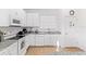Well-equipped kitchen featuring white cabinets and granite countertops at 2654 Rosemont Cir, Davenport, FL 33837