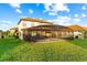 Large backyard with screened pool and patio area at 2654 Rosemont Cir, Davenport, FL 33837