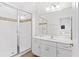 Clean bathroom with walk-in shower and white vanity at 2654 Rosemont Cir, Davenport, FL 33837