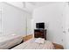 Two twin beds in a well-lit bedroom with wood floors at 2654 Rosemont Cir, Davenport, FL 33837