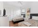 Two twin beds in a bedroom, featuring wood floors and a TV at 2654 Rosemont Cir, Davenport, FL 33837