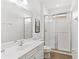 Clean bathroom with a walk-in shower and tiled flooring at 2654 Rosemont Cir, Davenport, FL 33837