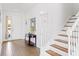 View of entryway with staircase, tile floor and console table at 2654 Rosemont Cir, Davenport, FL 33837