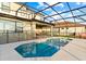 Relaxing pool and patio area with screened enclosure at 2654 Rosemont Cir, Davenport, FL 33837