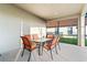 Screened patio with table and chairs, great for outdoor dining at 2654 Rosemont Cir, Davenport, FL 33837