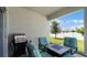 Relaxing back patio with seating area and grill, perfect for outdoor entertaining at 2716 Fieldbrooke Way, Edgewater, FL 32141