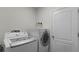 Laundry room with washer, dryer, and storage at 2716 Fieldbrooke Way, Edgewater, FL 32141