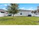 Backyard with patio and grassy area, perfect for outdoor relaxation at 2716 Fieldbrooke Way, Edgewater, FL 32141
