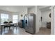 Open concept kitchen with stainless steel appliances and granite countertops at 2716 Fieldbrooke Way, Edgewater, FL 32141