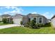 House exterior with a well-maintained lawn at 2716 Fieldbrooke Way, Edgewater, FL 32141