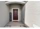 Elegant front door entrance with a welcoming mat at 2716 Fieldbrooke Way, Edgewater, FL 32141