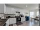 Modern kitchen boasts stainless steel appliances and granite countertops at 2716 Fieldbrooke Way, Edgewater, FL 32141