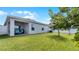 Spacious backyard with grassy lawn, providing ample space for recreation at 2716 Fieldbrooke Way, Edgewater, FL 32141
