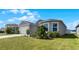 Two-story house exterior with a two-car garage and landscaped yard at 2716 Fieldbrooke Way, Edgewater, FL 32141