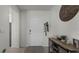 Inviting entryway with a wooden console table and a white door at 2716 Fieldbrooke Way, Edgewater, FL 32141