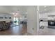 Open concept kitchen with stainless steel appliances and white cabinets at 2716 Fieldbrooke Way, Edgewater, FL 32141