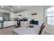 Modern kitchen featuring white shaker cabinets, granite countertops, and a breakfast bar at 2716 Fieldbrooke Way, Edgewater, FL 32141