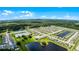 Aerial view of a large residential community with lakes and lush greenery at 2716 Fieldbrooke Way, Edgewater, FL 32141