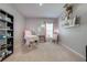Home office with treatment table, shelves, and plenty of natural light at 1475 Haines Dr, Winter Haven, FL 33881