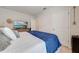Bedroom with blue blanket, TV, and dresser at 1475 Haines Dr, Winter Haven, FL 33881