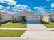 Single story house with a two car garage and well-manicured lawn at 1475 Haines Dr, Winter Haven, FL 33881
